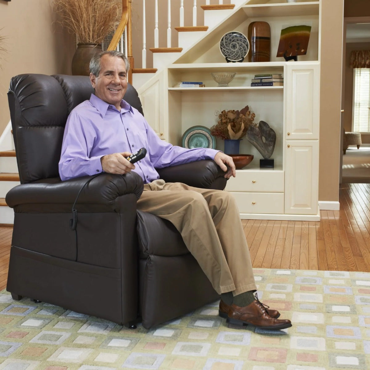 Man sitting comfortably in his Golden Cloud PR510 lift chair in a living room